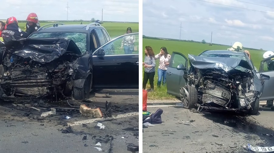 Two cars severely damaged in a head-on collision on a rural road; debris scattered, firefighters and bystanders on scene.
