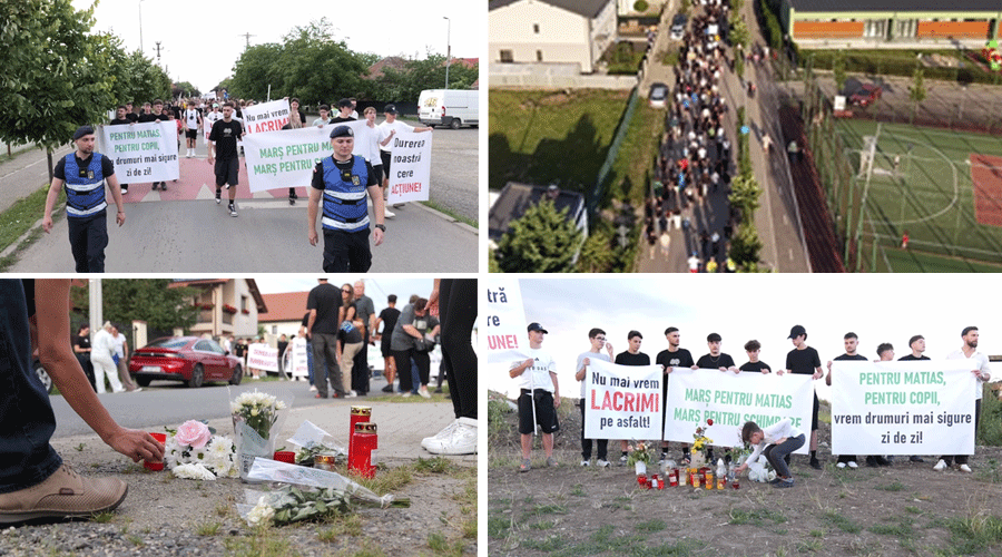 Front-line protesters march on a residential street, carrying large banners with messages.