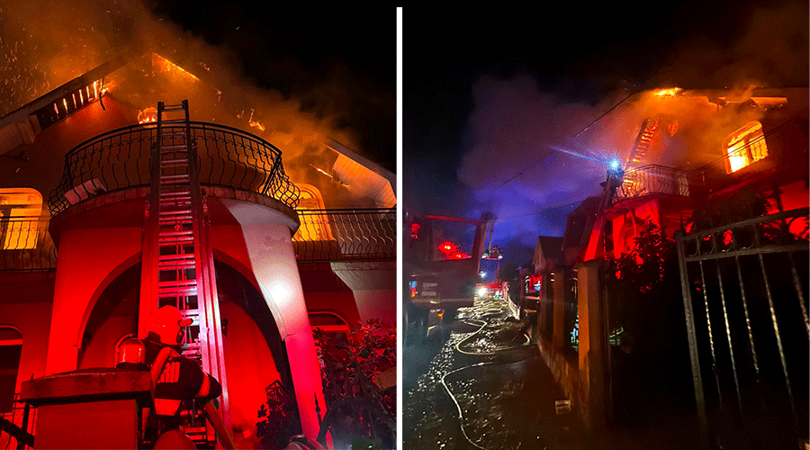 House on fire at night with flames above a balcony, firefighter on a ladder spraying water down a red-lit facade (split-screen image).
