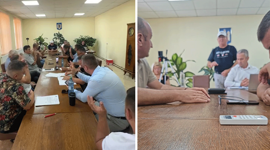 Two photos from a meeting: left shows many people seated around a long conference table with papers and water bottles in a bright room; right shows a closer view with hands on a table and a white remote control in the foreground as others sit nearby.