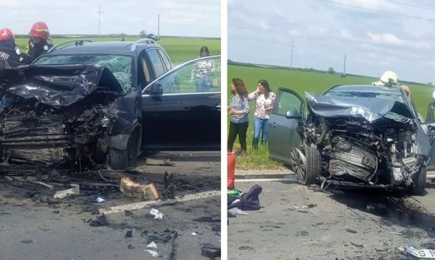 Two cars severely damaged in a head-on collision on a rural road; debris scattered, firefighters and bystanders on scene.