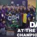 Group of students and mentors pose with a green robot and a 'CSH' banner at a robotics championship; Day 3 at the First Championship text visible.