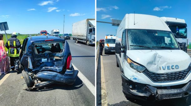 Two vehicles damaged in a highway collision: a crushed small car on the left with responders nearby; a dented white van on the right with an ambulance behind.
